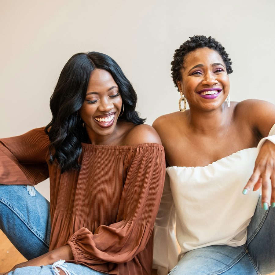 Two friends laughing together